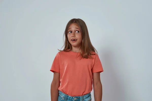 Front view of scared little girl looking away — Stock Photo, Image