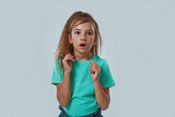 Front view of scared little girl with open mouth — Stock Photo, Image