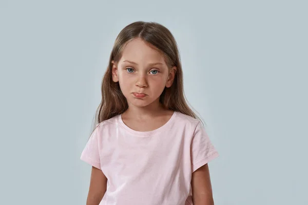 Cropped of embarrassed little girl look at camera — Stock Photo, Image