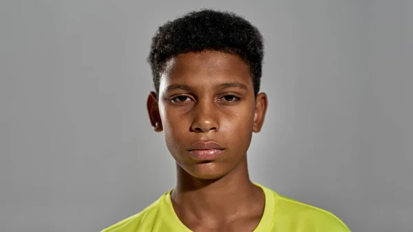 Portrait of serious black boy looking at camera — Fotografia de Stock