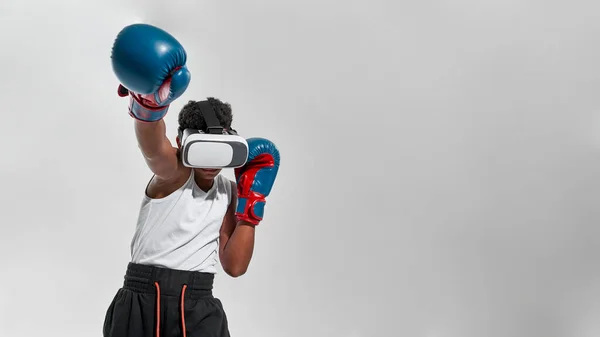 Partial of black boy boxer wear VR glasses boxing — Stock Photo, Image