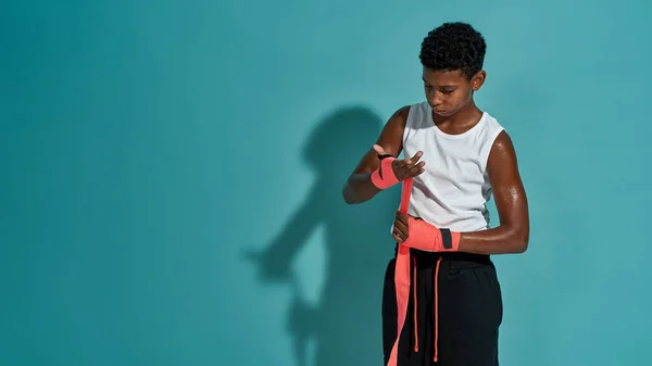 Black boy boxer wrapping boxing elastic bandage — Fotografia de Stock