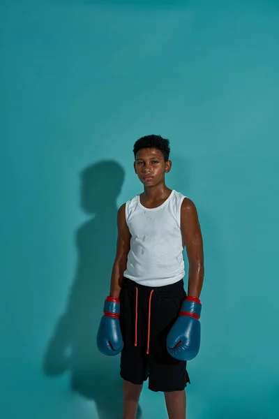 Front view of black boy boxer looking at camera — ストック写真