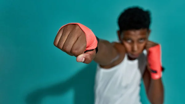 Focus on foreground of hitting fist of boy boxer — ストック写真