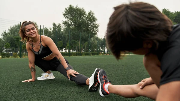 Caucasian mother and son warm up before training — Stok fotoğraf