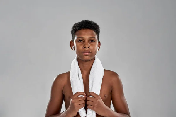 Cropped image of confident sporty boy with towel — Stok fotoğraf