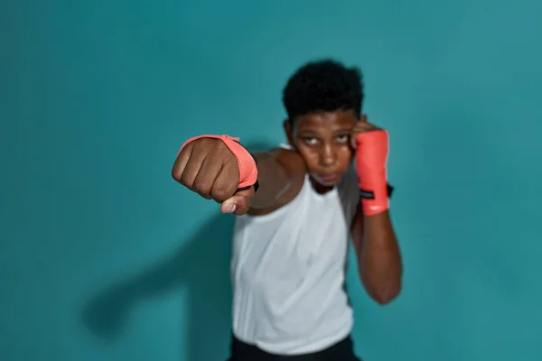 Focus of hitting fist of blurred boy boxer — ストック写真