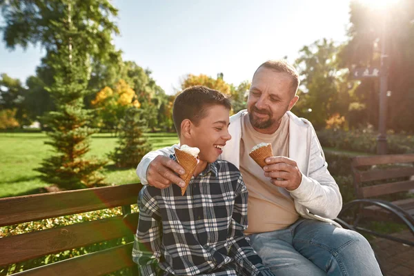 Father eat and feed ice cream son with disability — Stok fotoğraf