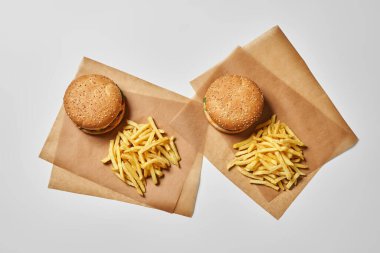 Top view of two burgers and french fries