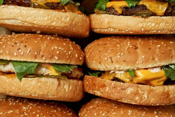Partial close up background of fast food burgers — Stok fotoğraf