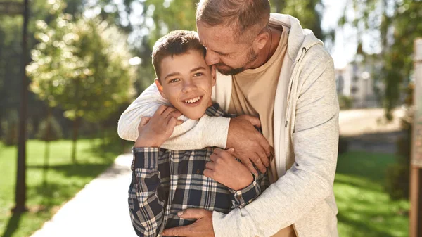 Happy european father hug son with cerebral palsy — Stok fotoğraf