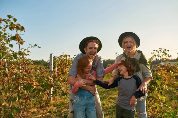 Pleased Laughing Young Caucasian Family Enjoying Time Together Countryside Garden — Stockfoto