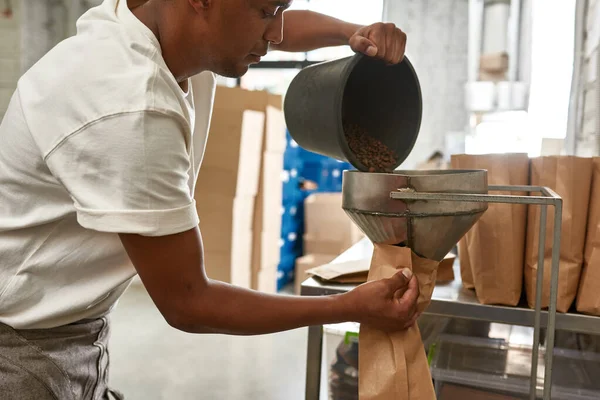 Obscure Face Male Worker Barista Pouring Out Roasted Coffee Beans — Fotografia de Stock