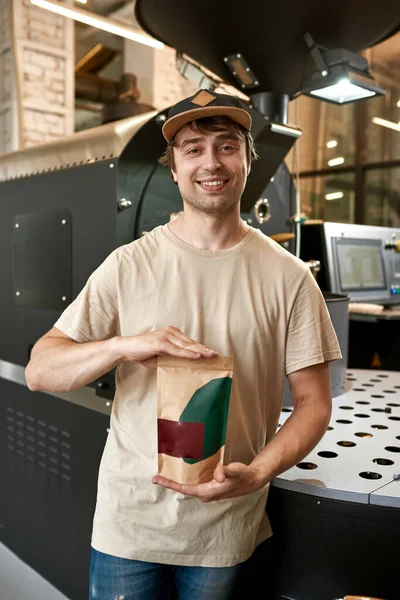 Smiling European Male Worker Businerss Owner Showing Coffee Package Industrial — Fotografia de Stock