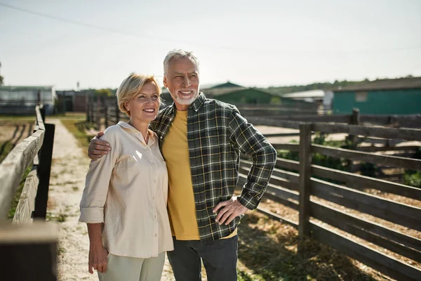 Mature Farmer Couple Hugging Looking Away Farm Ranch Happy Caucasian — ストック写真