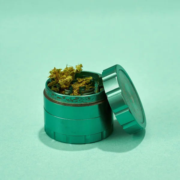 Opened Green Jar Dry Cutting Marijuana Buds Isolated Turquoise Background — Stockfoto