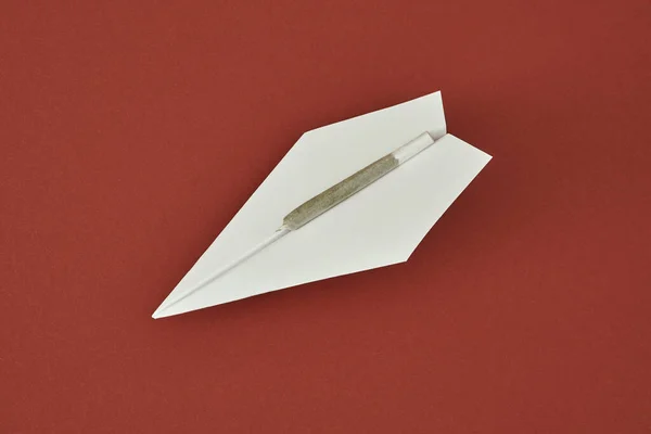 Cannabis Rolled Joint White Paper Plane Isolated Red Background Light — Stock Photo, Image