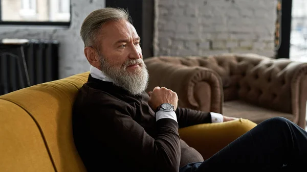 Grey Hair Thoughtful Caucasian Man Sitting Sofa Looking Away Spacious — Stockfoto