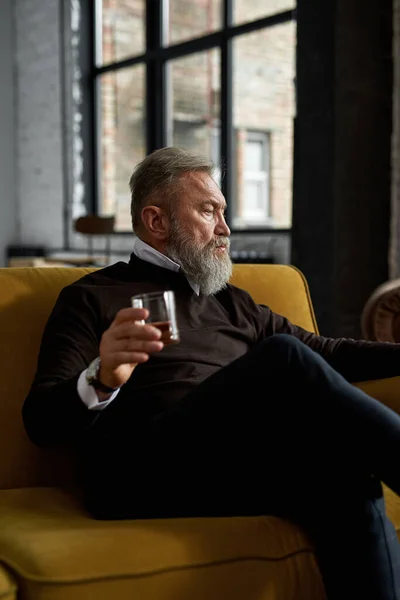 Grey Hair Focused Caucasian Man Drinking Whiskey Brandy Sofa Home — Photo