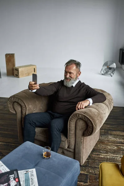 Grey Hair Smiling Caucasian Man Taking Selfie Smartphone Armchair Spacious — Stockfoto