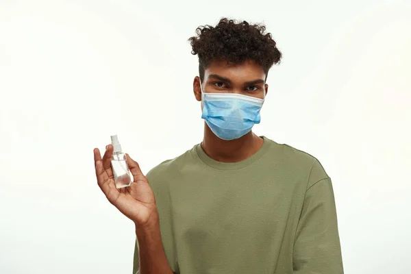 Black Guy Wearing Medical Mask Holding Sanitizer Hand Partial Young — Foto de Stock