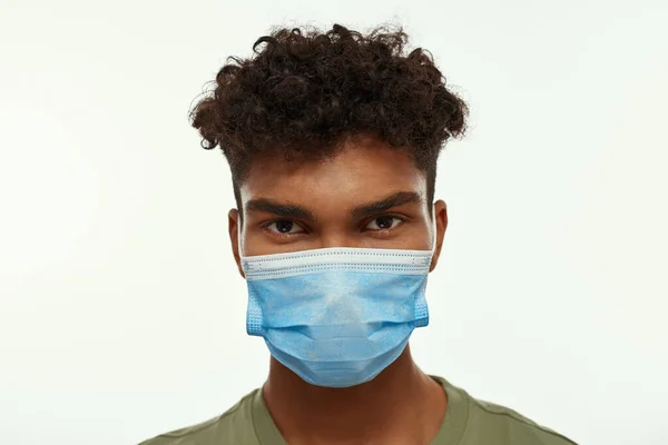 Portrait Black Guy Wearing Medical Mask Looking Camera Partial Young —  Fotos de Stock