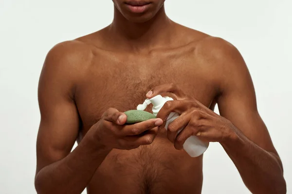 Cropped African American Guy Pouring Cosmetic Cream Bottle Washcloth Young — Stock Fotó