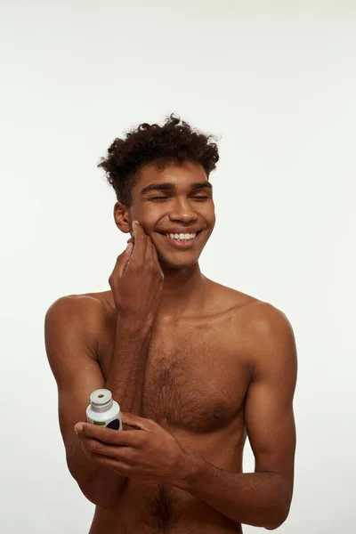 Smiling Black Guy Closed Eyes Smearing Face Shave Gel Young — Fotografia de Stock