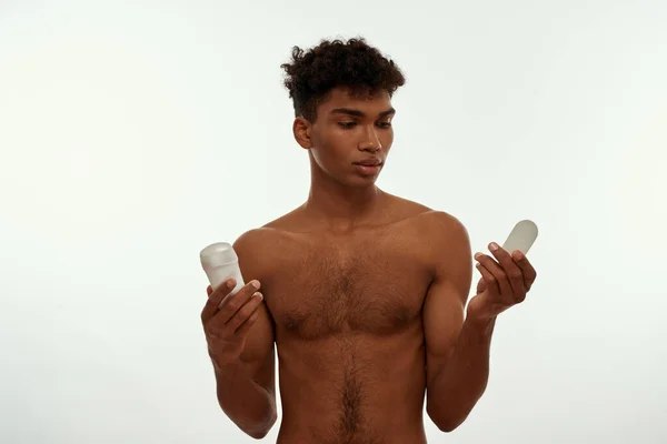 Focused Black Guy Holding Looking Deodorant Paper Him Young Brunette — Fotografia de Stock