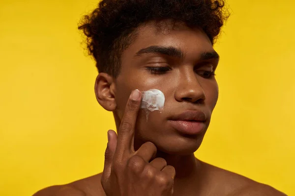 Partial Image Black Guy Smearing Cosmetic Cream His Face Young — Stock Fotó
