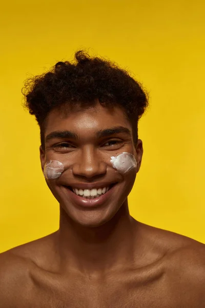 Cropped Image Smiling Black Guy Cosmetic Cream His Face Looking — Stock Fotó
