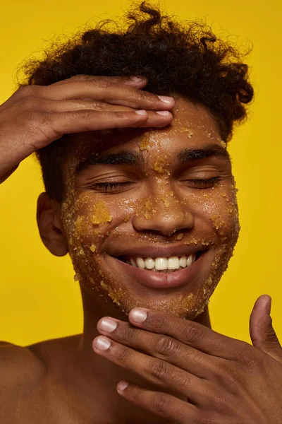 a person with a honey scrub on the face