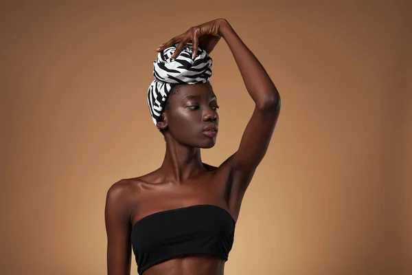 Serious Fashionable Black Girl Turban Touching Traditional African Turban Her — Stockfoto