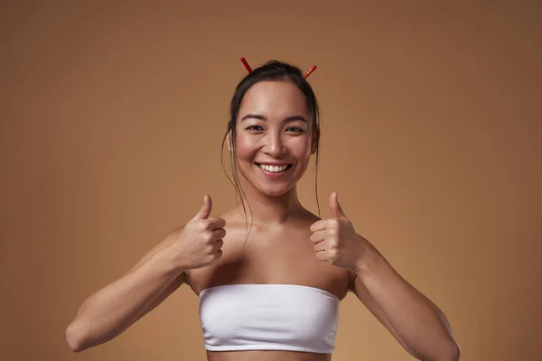 Smiling Fashionable Asian Girl Showing Thumbs Gesture Looking Camera Pretty — Foto Stock