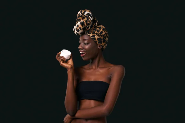 Pleased Black Girl Open Mouth Holding Container Cosmetic Cream Young — Photo
