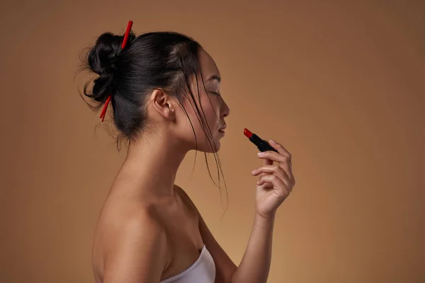 Side View Stylish Asian Girl Closed Eyes Painting Lips Lipstick — Foto de Stock