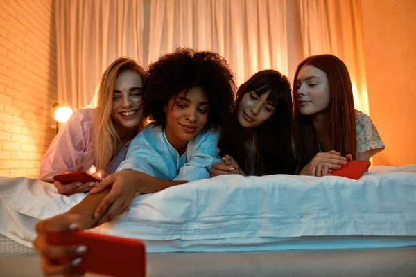 Young Multiracial Girlfriends Taking Selfie Smartphone Bed Girlish Sleepover Black —  Fotos de Stock