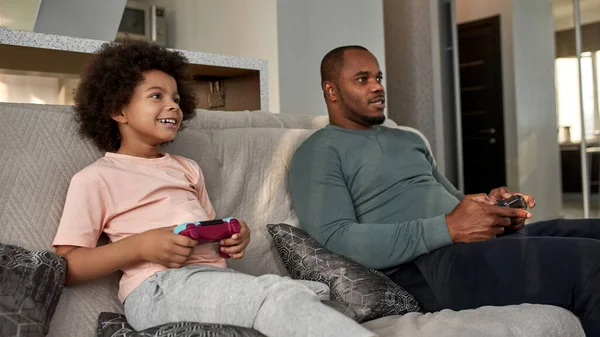 Black Smiling Little Boy Focused Father Playing Video Game Joysticks — Stock Photo, Image