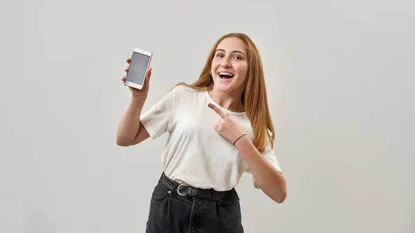 Excited Caucasian Female Teenage Open Mouth Showing Smartphone Looking Camera — Stock Photo, Image