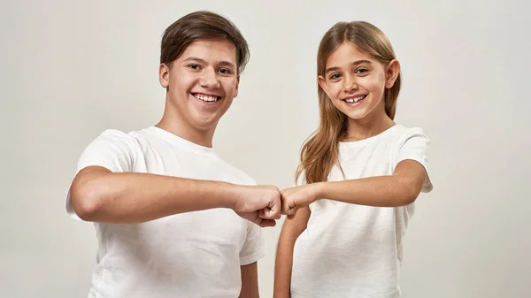 Teenage Boy Little Girl Bumping Fists Each Other Smiling Caucasian — Stock Photo, Image