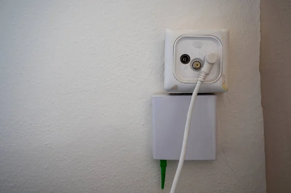 white electrical outlet on the wall