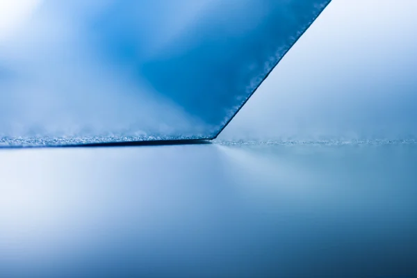 Imagem de fundo de um papel azul sobre fundo de papel — Fotografia de Stock