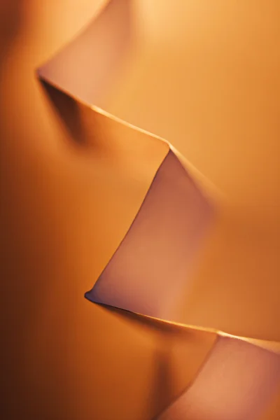 Picture of a orange zig-zag paper on paper background — Stock Photo, Image