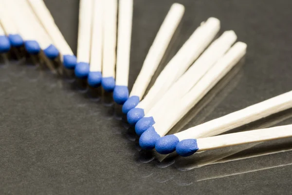 Unused matches with blue head screw — Stock Photo, Image