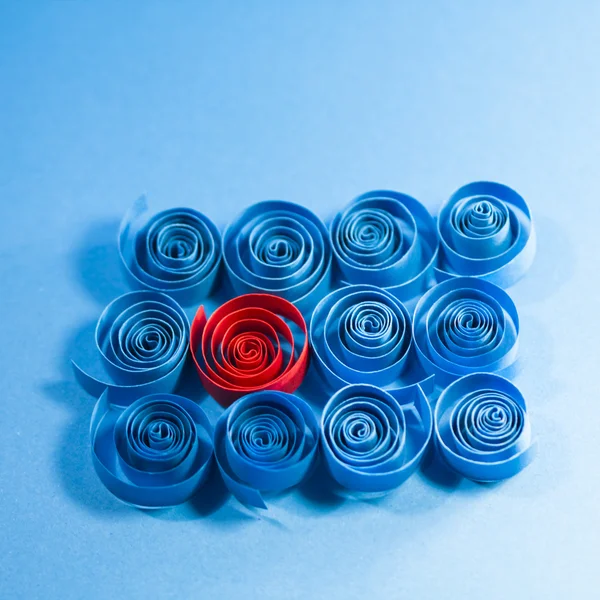 Picture of blue and red paper spirals on paper background — Stock Photo, Image