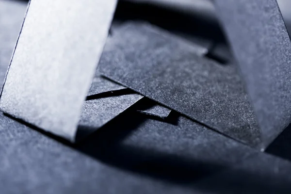 Dunkelblaue Papierformen und Schatten — Stockfoto