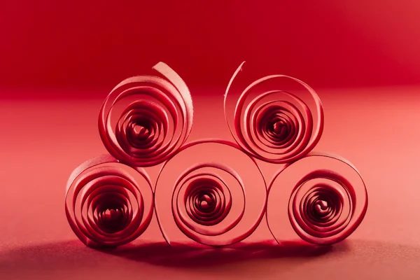 Picture of red paper spirals on paper background — Stock Photo, Image