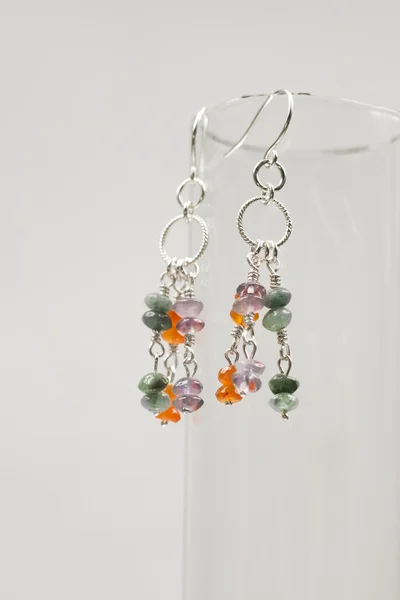 Silver earrings with amethyst, agate and emerald gemstones — Stock Photo, Image