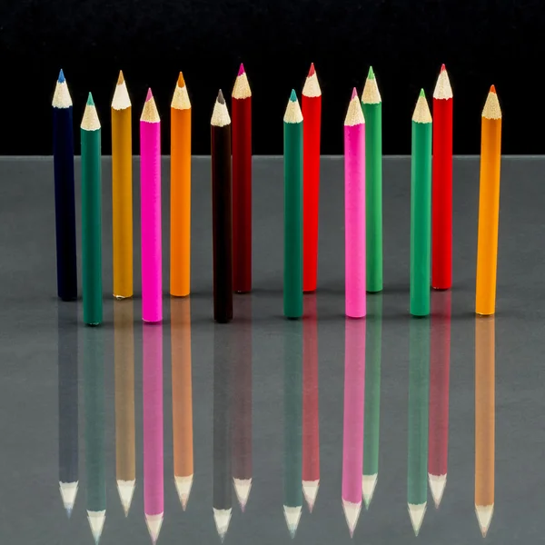 Group of sharp colored pencils with reflexions — Stock Photo, Image
