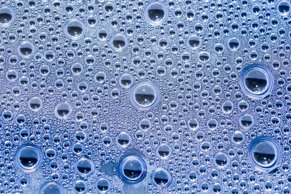 Water drops on transparent plastic surface — Stock Photo, Image